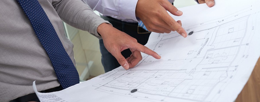 Melbourne commercial architects reviewing building plans for upgrade compliance and NCC requirements