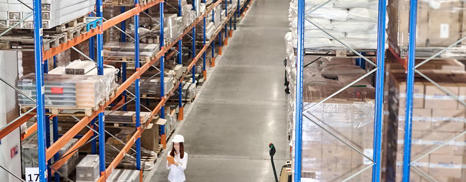 Warehouse interior with high clearance vertical storage and automation systems