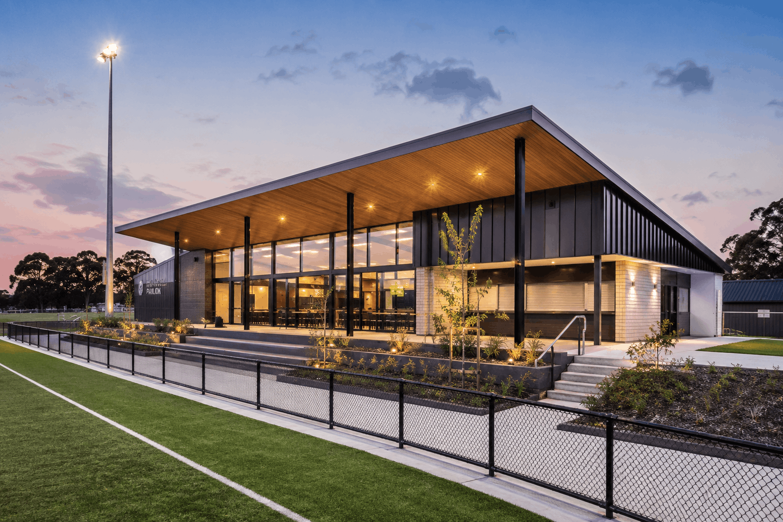 Architectural planning for a multi-sport pavilion showing efficient circulation, storage and shared facilities